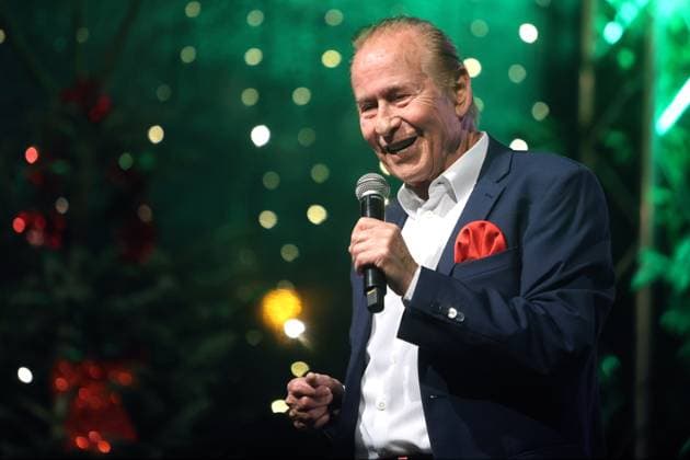 German music legends Born on July 29, 1943, Lothar Bernhard Walter, who achieved great success as a pop singer and film actor under his stage name Michael Holm, sings on a stage in Essen Steele at the local Christmas market in the run-up to Christmas Essen North Rhine-Westphalia Germany Steele