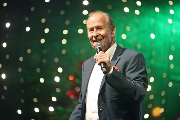 German music legends Born on July 29, 1943, Lothar Bernhard Walter, who achieved great success as a pop singer and film actor under his stage name Michael Holm, sings on a stage in Essen Steele at the local Christmas market in the run-up to Christmas Essen North Rhine-Westphalia Germany Steele