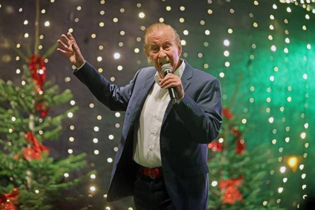 German music legends Born on July 29, 1943, Lothar Bernhard Walter, who achieved great success as a pop singer and film actor under his stage name Michael Holm, sings on a stage in Essen Steele at the local Christmas market in the run-up to Christmas Essen North Rhine-Westphalia Germany Steele