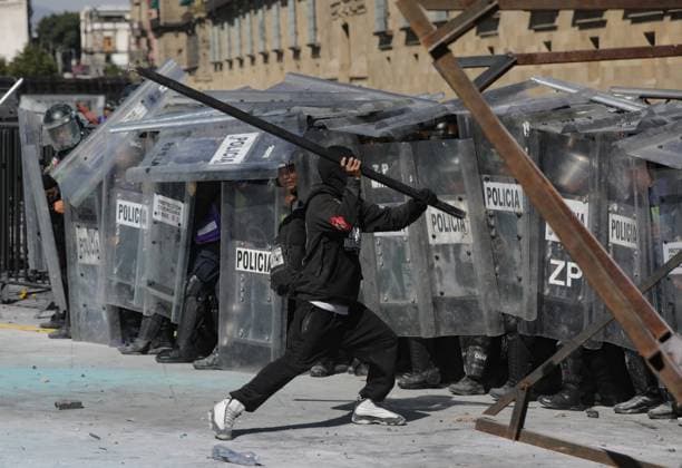 November 15, 2025 in Mexico City, Mexico: A person confronts riot police during the Gen Z demonstration at main square Zocalo against the Mexican government following the murder of Uruapan Mayor Carlos Manzola, while Mexico s President, Claudia Sheinbaum, has questioned the legitimacy of the movement in recent days. Mexico City Mexico - ZUMAe321 20251115_zia_e321_045 Copyright: xIanxRoblesx