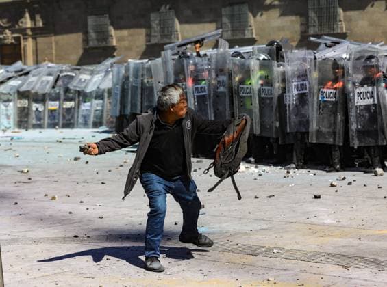 November 15, 2025 in Mexico City, Mexico: A person confronts riot police during the Gen Z demonstration at main square Zocalo against the Mexican government following the murder of Uruapan Mayor Carlos Manzola, while Mexico s President, Claudia Sheinbaum, has questioned the legitimacy of the movement in recent days. Mexico City Mexico - ZUMAe321 20251115_zia_e321_092 Copyright: xIanxRoblesx