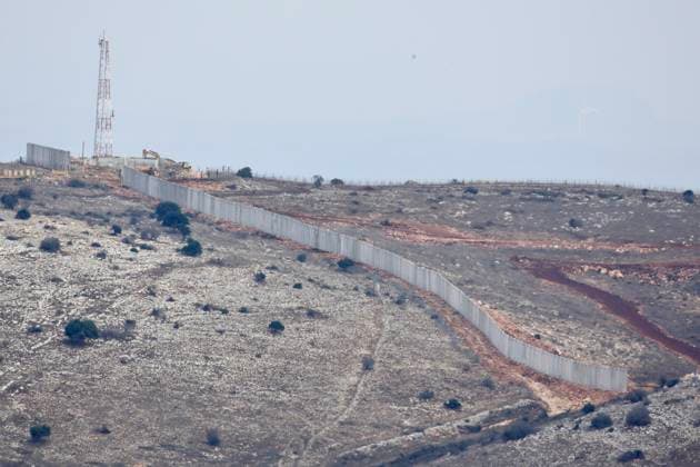 (251117) -- YAROUN, Nov. 17, 2025 -- This photo taken on Nov.16, 2025 shows a section of the wall that Israel is building on the Yaroun border in Southern Lebanon. The United Nations Interim Force in Lebanon (UNIFIL) on Nov. 14 confirmed that sections of concrete barriers recently erected by the Israel Defense Forces (IDF) crossed into Lebanese territory, violating UN Security Council Resolution 1701 and Lebanon s sovereignty. The survey found that the barrier extended beyond the Blue Line, cutting off more than 4,000 square meters of Lebanese land from local residents. (Photo by Xinhua) LEBANON-YAROUN-BORDER-ISRAEL-WALL AlixHashisho 