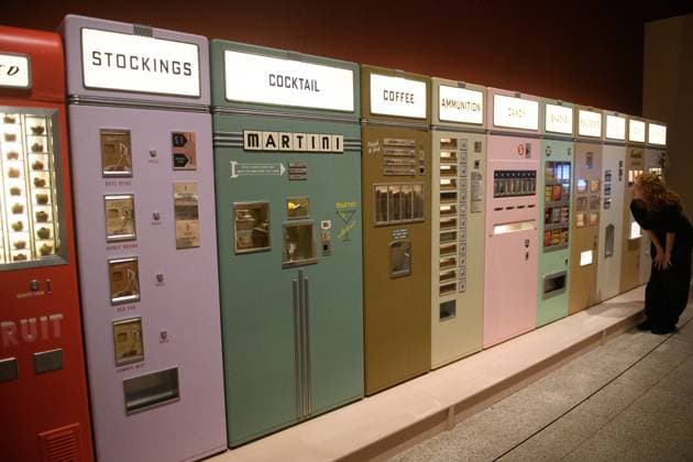 Wes Anderson: The Archives Press Preview at Design Museum, London, UK A staff member views A bank of Vending Machines created for Asteroid City by Atelier Simon Weisse and Erica Dorn (2021) at a photocall for The Design Museum s Wes Anderson: The Archives Exhibition at The Design Museum in London, England, UK on Monday 17 November 2025. The exhibition runs from 21 November 2025 - 26 July 2026., Credit:Justin Ng Avalon UK, England, London, Design Museum  Copyright: xJustinxNgx xAvalonx 1052941821