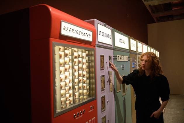 Wes Anderson: The Archives Press Preview at Design Museum, London, UK A staff member views A bank of Vending Machines created for Asteroid City by Atelier Simon Weisse and Erica Dorn (2021) at a photocall for The Design Museum s Wes Anderson: The Archives Exhibition at The Design Museum in London, England, UK on Monday 17 November 2025. The exhibition runs from 21 November 2025 - 26 July 2026., Credit:Justin Ng Avalon UK, England, London, Design Museum  Copyright: xJustinxNgx xAvalonx 1052941838