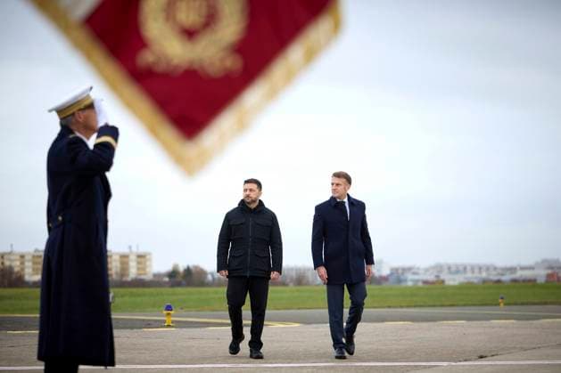 November 17, 2025, Velizy-Villacoublay, France: Ukrainian President Volodymyr Zelenskyy, left, and French President Emmanuel Macron, right, walk past honor guards on arrival at Villacoublay air base, November 17, 2025, in Velizy-Villacoublay, France. The two nations signed an agreement to provide Ukraine with 100 of France s Rafale F4 fighter jets and advanced air defense systems. Velizy-Villacoublay France - ZUMAp138 20251117_zaa_p138_023 Copyright: xUkrainexPresidency UkrainianxPrex