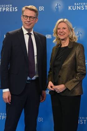 Markus BLUME CSU,Bavarian State Minister for Science and the Arts with Katja WILDERMUTH Director of Bavarian Broadcasting BR Bavarian Art Award 2025 ceremony on 18 11 2025 at the Bergson Kunstkraftwerk in Munich