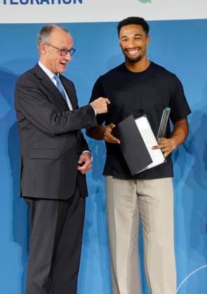 Patron Federal Chancellor Friedrich Merz, Leo Neugebauer track and field decathlon athlete at the TALISMAN 2025 award ceremony of the Deutschlandstiftung Integration at the Allianz Forum in Berlin