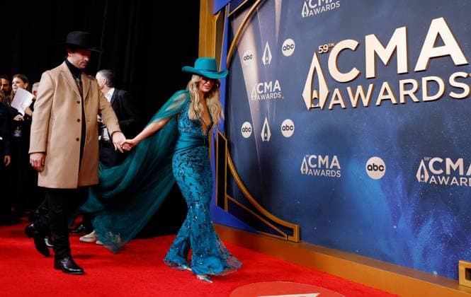 (L-R) Lainey Wilson and Devlin Duck Hodges arrive on the red carpet for the 59th CMA Awards in Nashville, Tennessee, on Wednesday, November 19, 2025.  NAS20251119195 JOHNxANGELILLO