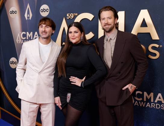 (L-R) Dave Haywood, Hillary Scott and Charles Kelley arrive on the red carpet for the 59th CMA Awards in Nashville, Tennessee, on Wednesday, November 19, 2025.  NAS20251119208 JOHNxANGELILLO