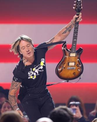 Keith Urban performs onstage during the 59th CMA Awards at the Bridgestone Arena in Nashville, Tennessee, on Wednesday, November 19, 2025.  NAS20251119290 JOHNxANGELILLO