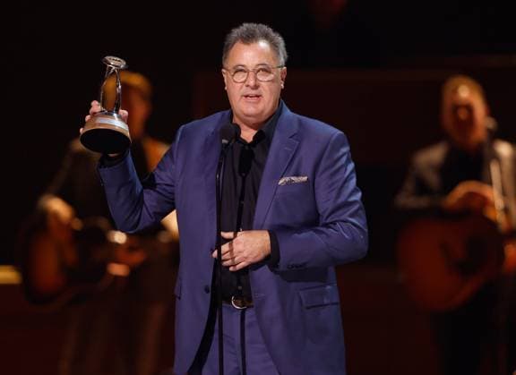 Vince Gill accepts the Lifetime Achievement Award onstage during the 59th CMA Awards at the Bridgestone Arena in Nashville, Tennessee, on Wednesday, November 19, 2025.  NAS20251119361 JOHNxANGELILLO