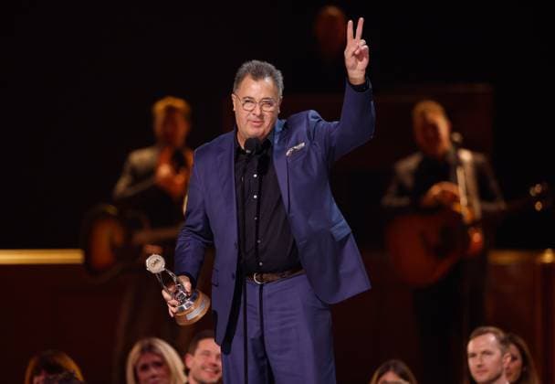 Vince Gill accepts the Lifetime Achievement Award onstage during the 59th CMA Awards at the Bridgestone Arena in Nashville, Tennessee, on Wednesday, November 19, 2025.  NAS20251119363 JOHNxANGELILLO
