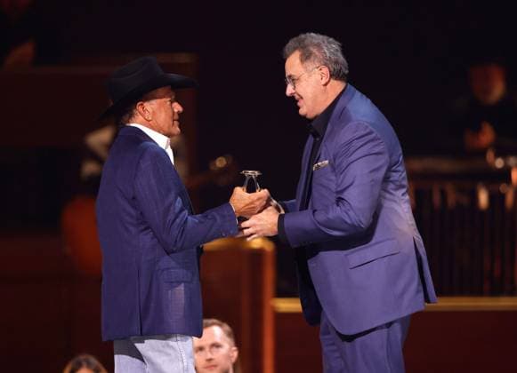 George Strait presents Vince Gill with the Lifetime Achievement Award onstage during the 59th CMA Awards at the Bridgestone Arena in Nashville, Tennessee, on Wednesday, November 19, 2025.  NAS20251119364 JOHNxANGELILLO