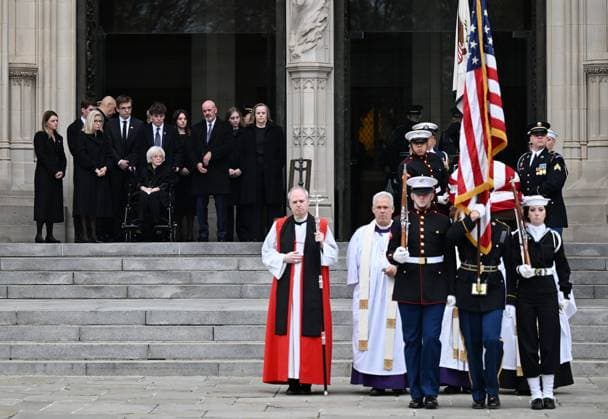 A military guard carries the casket of former Vice President Dick Cheney out of Washington National Cathedral as his family looks on following Cheney s funeral in Washington DC on Thursday, November 20, 2025. Cheney, vice president under President George W. Bush from 2001 to 2009, died at the age of 84 on November 3, 2025.  WAP20251120712 ANNABELLExGORDON