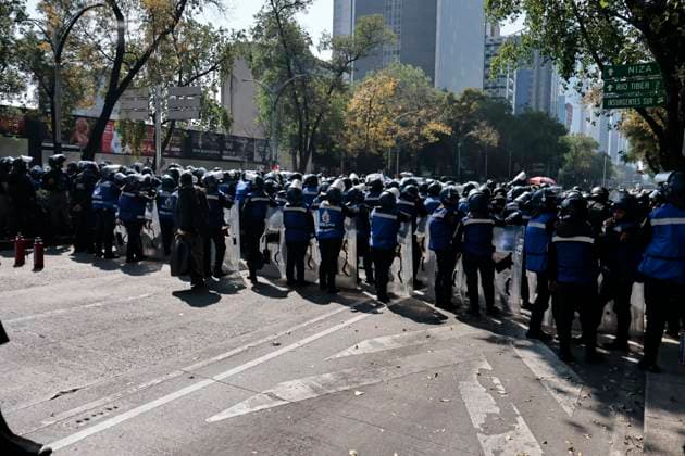 November 20, 2025, Mexico, Cdmx, Mexico: A group of approximately one hundred members of Generation Z, or Gen Z, marched down Paseo de la Reforma Avenue to protest the insecurity, corruption, and drug trafficking plaguing the country. They were intercepted by city police (riot police), who blocked their progress due to the ongoing military parade commemorating the anniversary of the Mexican Revolution. They were detained for a couple of hours until the police allowed them to proceed toward the Zo³calo, Mexico City s main square. However, the police again blocked their path one block before they reached the Plaza de la Constitucio³n. The protest was peaceful, with members of the Black Bloc once again using the One Piece flag, a Japanese - ZUMAp204 20251120_zip_p204_001 Copyright: xJosuexPerezx