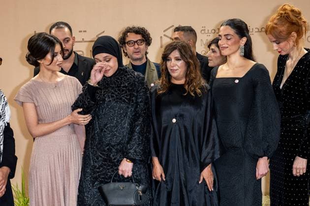 Opening of Doha Film Festival - Doha Film team of ‘Voice of Hind Rajab’, and mother of Hind Rajab (crying), around director Kaouther Ben Hania (center) arrive to the opening ceremony of Doha Film Festival 2025, at Katara cultural village, in Doha, Qatar, on November 20, 2025. Photo by Ammar Abd Rabbo ABACAPRESS.COM Doha Qatar  Copyright: xAbdxRabboxAmmar ABACAx