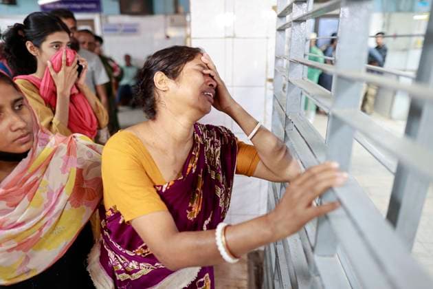 November 21, 2025, Dhaka, Bangladesh: A woman breaks down in grief at Dhaka Medical College Hospital as she waits for news of her injured son following the powerful earthquake that struck Dhaka, Bangladesh, on 21 November 2025. A powerful earthquake measuring between 5.5 and 5.7 struck Dhaka late Friday morning, sending panic across the city as buildings shook and residents rushed into the streets. According to the Bangladesh Meteorological Department, the shallow quake Ã¢â‚¬ with an epicenter in Madhabdi, Narsingdi Ã¢â‚¬ caused significant jolts in the capital and surrounding districts. Emergency services reported several structural damages, including a collapsed rooftop railing in Armanitola and a tilted eight-storey building in Swa - ZUMAd117 20251121_fap_d117_015 Copyright: xSuvraxKantixDasx