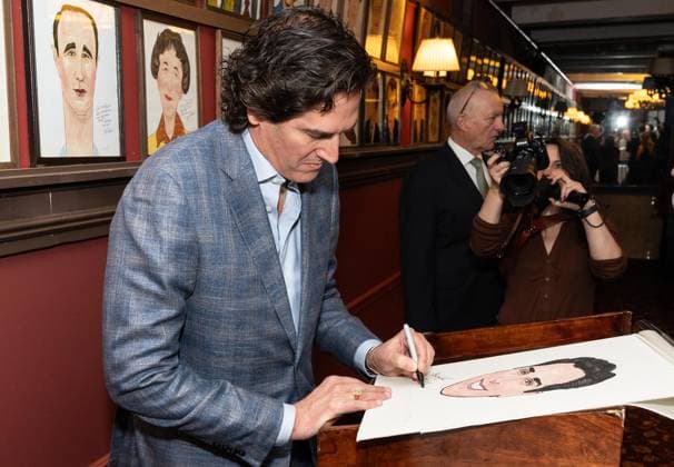 November 21, 2025, Bronx, New York, USA: Nick Scandalios, Executive Vice President of Nederlander Organization owner of many theaters on Broadway autographs his portrait during unveiling at Sardi s in New York, NY on November 21, 2025 Bronx USA - ZUMAr339 20251121_znp_r339_008 Copyright: xLevxRadinx