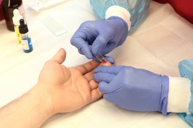 Medical worker performs a rapid finger-prick blood test on a donor during a medical check-up on the second floor of the Teplokrovni mobile hub at the Warm Weekend event, Kyiv, Ukraine, on November 20, 2025. The first floor features an interactive exhibition on blood and donation (Photo by Volodymyr Tarasov Ukrinform) Warm Weekend at Teplokrovni mobile hub  Copyright: xVolodymyrxTarasovx