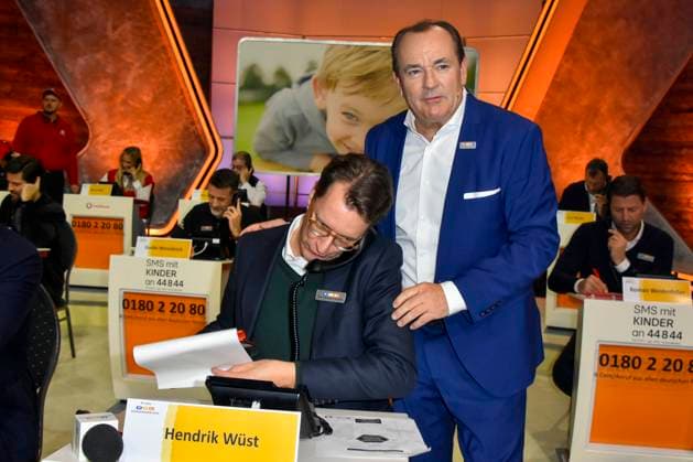 ABB Hendrik Josef Wüst Wuest CDU politician with Wolfram Kons Moderator State Premier of North Rhine-Westphalia North Rhine-Westphalia as a guest on the donation phone in the RTL studio at the charity for the 30th anniversary of the RTL telethon we help children at RTL Germany on 21 11 2025 2 Donation Day in Cologne Deutz NRW Germany