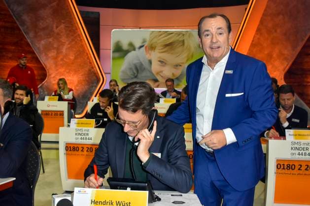 ABB Hendrik Josef Wüst Wuest CDU politician with Wolfram Kons Moderator State Premier of North Rhine-Westphalia North Rhine-Westphalia as a guest on the donation phone in the RTL studio at the charity for the 30th anniversary of the RTL telethon we help children at RTL Germany on 21 11 2025 2 Donation Day in Cologne Deutz NRW Germany
