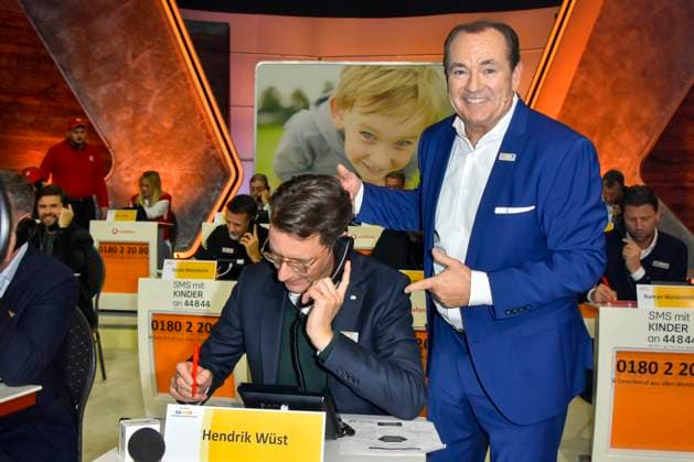 ABB Hendrik Josef Wüst Wuest CDU politician with Wolfram Kons Moderator State Premier of North Rhine-Westphalia North Rhine-Westphalia as a guest on the donation phone in the RTL studio at the charity for the 30th anniversary of the RTL telethon we help children at RTL Germany on 21 11 2025 2 Donation Day in Cologne Deutz NRW Germany
