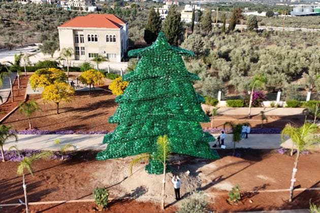 Lebanese activist builds 10-meter cedar tree from 450,000 recycled bottles AMIOUN, LEBANON - NOVEMBER 23: Lebanese environmental activist Caroline Chabtini, together with a team of volunteers, has constructed a 10-meter-tall model of the iconic Lebanese cedar tree using 450,000 green plastic bottles in Amioun, Lebanon on November 23, 2025. The project aims to raise awareness about recycling, environmental protection, and the harmful impact of plastic bottles on nature. Chabtini’s creation has earned a place in the Guinness World Records as the largest tree made entirely from plastic bottles. Houssam Shbaro Anadolu Amioun Lebanon. Editorial use only. Please get in touch for any other usage.  Copyright: x2025xAnadoluxHoussamxShbarox