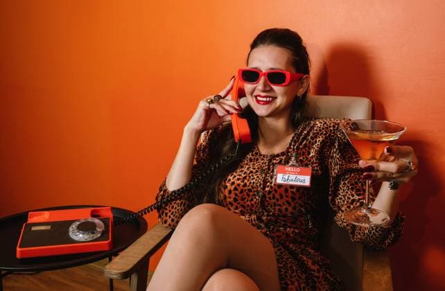 Retro portrait with leopard print dress and phone in hand model released, Symbolfoto, AAF00301