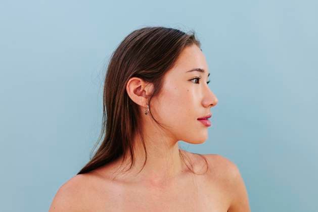 Side portrait with natural skin and clean beauty on blue background model released, Symbolfoto, FOMF00532