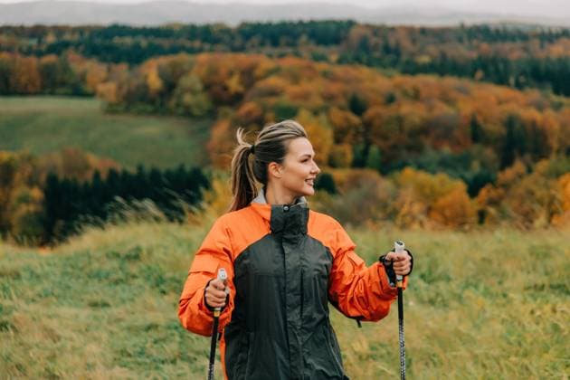 Woman enjoying Nordic walking in autumn mountain landscape model released, Symbolfoto, VSNF04462