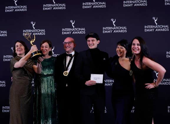 German director Ralf Kukula (3L) and his team arrive in the press room with the International award for Auf Fritzis Spuren Wie war das so in der DDR at the 53rd International Emmy Awards at New York Hilton Midtown in New York City on Monday, November 24, 2025.  NYP20251124267 JohnxAngelillo
