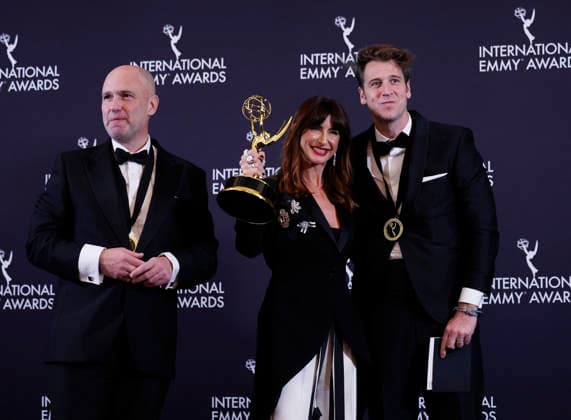 Spanish director Joanna Pardos Servulo (L) and producer Javier Martinez Suarez arrive in the press room with the Sports Documentary award for It s All Over: The Kiss That Changed Spanish Football at the 53rd International Emmy Awards at New York Hilton Midtown in New York City on Monday, November 24, 2025.  NYP20251124271 JohnxAngelillo