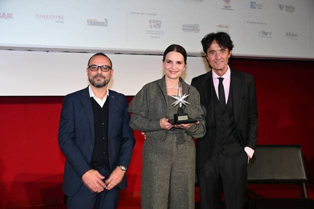 43rd Turin Film Festival 2025, Day 4 - Stella della Mole Award Ceremony to Juliette Binoche. Pictured: Juliette Binoche, Giulio Base  Copyright: xMaurizioxD Avanzox xipa-agency.netx xDxAvanzo xMangiarottix IPA_Agency_IPA68371090