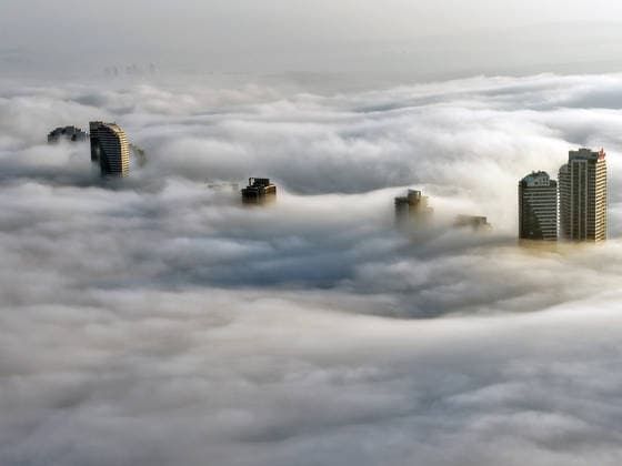 (251126) -- ANKARA, Nov. 26, 2025 -- An aerial drone photo taken on Nov. 26, 2025 shows the fog-shrouded city view of Ankara, T¨¹rkiye. ( Handout via Xinhua) T?RKIYE-ANKARA-FOG MustafaxKaya 
