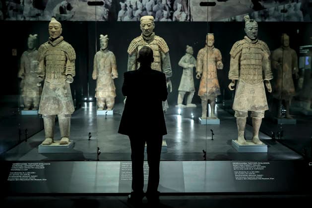 (251128) -- BUDAPEST, Nov. 28, 2025 -- A visitor views exhibits at the exhibition Civilization of the Qin and Han Dynasties - The First Chinese Emperor s Terracotta Warriors at the Museum of Fine Arts in Budapest, Hungary, Nov. 27, 2025. The Museum of Fine Arts in Budapest on Thursday opened one of the most significant Chinese cultural exhibitions ever held in Hungary, presenting more than 150 ancient artworks from the Qin and Han dynasties (221 BC-220 AD), including ten original Terracotta Warriors. Titled Civilization of the Qin and Han Dynasties - The First Chinese Emperor s Terracotta Warriors, the exhibition is jointly organized by the Museum of Fine Arts in Budapest and the Shaanxi Provincial Cultural Heritage Administration, 