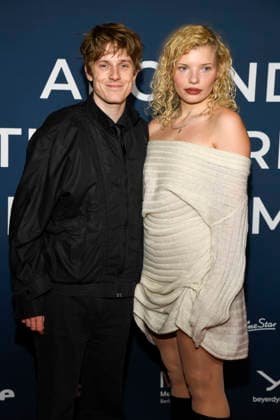ABBberlin Louis Hofmann with Luisa Celine Gaffron German actors as guests on the red carpet at the festival opening AROUND THE WORLD IN 14 FILMS at Cinestar Kino in der Kulturbrauerei Berlin on 28 11 2025 Berlin Germany