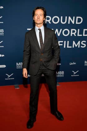 ABBberlin Tom Schilling Actor on the red carpet at the festival opening AROUND THE WORLD IN 14 FILMS at Cinestar Kino in der Kulturbrauerei Berlin on 28 11 2025 Berlin Germany