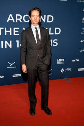 ABBberlin Tom Schilling Actor on the red carpet at the festival opening AROUND THE WORLD IN 14 FILMS at Cinestar Kino in der Kulturbrauerei Berlin on 28 11 2025 Berlin Germany