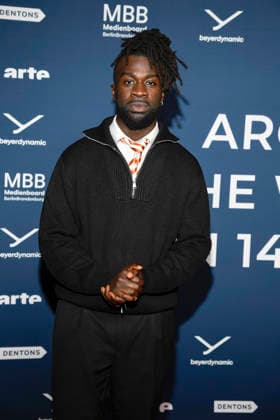 ABBberlin Mohamed Ndiaye on the red carpet at the festival opening AROUND THE WORLD IN 14 FILMS at Cinestar Kino in der Kulturbrauerei Berlin on 28 11 2025 Berlin Germany