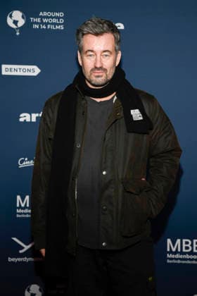 ABBberlin Christian Schwochow on the red carpet at the festival opening AROUND THE WORLD IN 14 FILMS at Cinestar Kino in der Kulturbrauerei Berlin on 28 11 2025 Berlin Germany