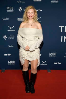 ABBberlin Luisa Celine Gaffron German actress on the red carpet at the festival opening AROUND THE WORLD IN 14 FILMS at Cinestar Kino in der Kulturbrauerei Berlin on 28 11 2025 Berlin Germany