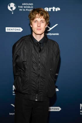 ABBberlin Louis Hofmann Actor on the red carpet at the festival opening AROUND THE WORLD IN 14 FILMS at Cinestar Kino in der Kulturbrauerei Berlin on 28 11 2025 Berlin Germany