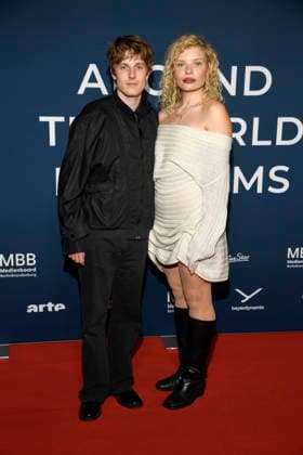 ABBberlin Louis Hofmann with Luisa Celine Gaffron German actors as guests on the red carpet at the festival opening AROUND THE WORLD IN 14 FILMS at Cinestar Kino in der Kulturbrauerei Berlin on 28 11 2025 Berlin Germany