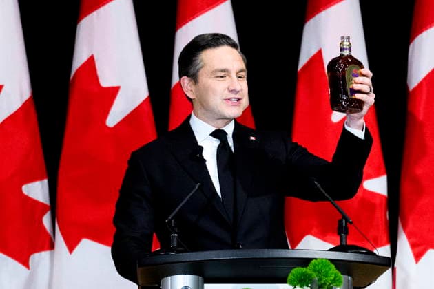 November 29, 2025, Ottawa, On, Canada: Leader of the Conservative Party Pierre Poilievre raises a bottle of Crown Royal while speaking during the Parliamentary Press Gallery Dinner in Ottawa, on Saturday, Nov. 29, 2025. Ottawa Canada  - ZUMAc35_ 20251129_zaf_c35_096 Copyright: xSpencerxColbyx