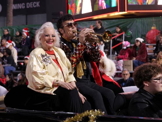 Carol Connors, David Longoria and Kathy Garver cruise down Hollywood Blvd. during The 93rd Annual Hollywood Christmas Parade With Grand Marshal Luke Wilson In Support of Marine Toys for Tots in Los Angeles on Sunday, November 30, 2025.  LAP20251130755 GERGxGRUDT