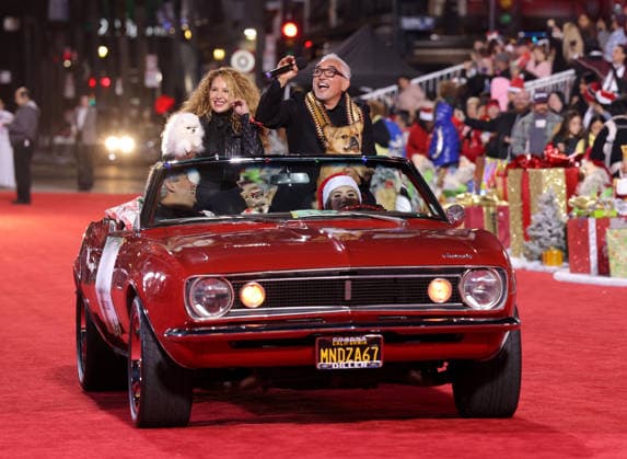 Connie Cossio and Cesar Millan cruise down Hollywood Blvd. during The 93rd Annual Hollywood Christmas Parade With Grand Marshal Luke Wilson In Support of Marine Toys for Tots in Los Angeles on Sunday, November 30, 2025.  LAP20251130768 GERGxGRUDT