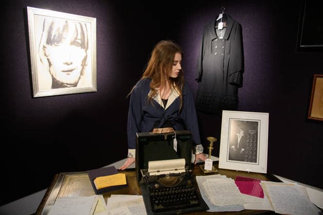 Bonhams Sound & Cinema: With Property from The Marianne Faithfull Estate Sale - Bonhams, London, UK - 1 December 2025 A staff member views (L) - A portrait of Marianne Faithfull, with dedication Say it in Broken English by Marlene Dumas (est. Â£2, 500 - Â£3, 500), (M) - Marianne Faithfull s personal vintage typewriter (est. Â£400 - Â£600), (R) A Louis Vuitton, Marc Jacobs Black Wool Coat owned by Marianne Faithfull (est. Â£300 - Â£500) which is on auction at Bonhams Sound & Cinema: With Property from The Marianne Faithfull Estate Sale ending from 3rd December 2025 at Bonhams in London, England, UK on Monday 1 December, 2025., Credit:Justin Ng Avalon UK, England, London, Bonhams  Copyright: xJustinxNgx xAvalonx 1055809836