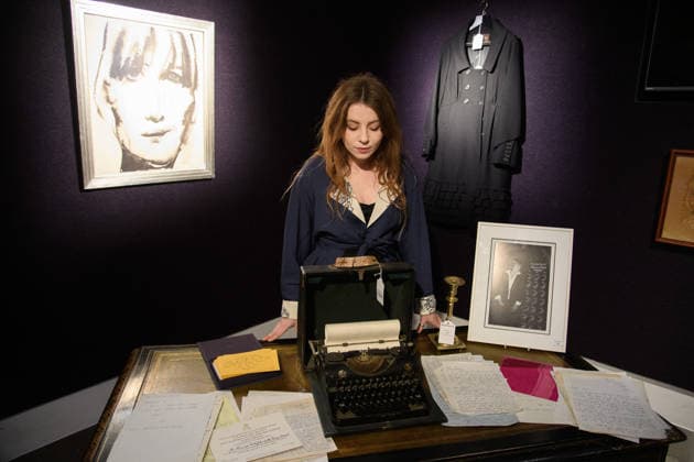Bonhams Sound & Cinema: With Property from The Marianne Faithfull Estate Sale - Bonhams, London, UK - 1 December 2025 A staff member views (L) - A portrait of Marianne Faithfull, with dedication Say it in Broken English by Marlene Dumas (est. Â£2, 500 - Â£3, 500), (M) - Marianne Faithfull s personal vintage typewriter (est. Â£400 - Â£600), (R) A Louis Vuitton, Marc Jacobs Black Wool Coat owned by Marianne Faithfull (est. Â£300 - Â£500) which is on auction at Bonhams Sound & Cinema: With Property from The Marianne Faithfull Estate Sale ending from 3rd December 2025 at Bonhams in London, England, UK on Monday 1 December, 2025., Credit:Justin Ng Avalon UK, England, London, Bonhams  Copyright: xJustinxNgx xAvalonx 1055809842