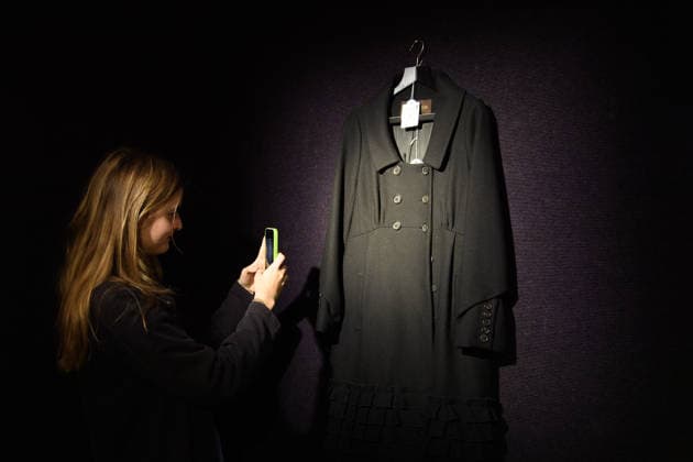 Bonhams Sound & Cinema: With Property from The Marianne Faithfull Estate Sale - Bonhams, London, UK - 1 December 2025 A staff member views A Louis Vuitton, Marc Jacobs Black Wool Coat owned by Marianne Faithfull (est. Â£300 - Â£500) which is on auction at Bonhams Sound & Cinema: With Property from The Marianne Faithfull Estate Sale ending from 3rd December 2025 at Bonhams in London, England, UK on Monday 1 December, 2025., Credit:Justin Ng Avalon UK, England, London, Bonhams  Copyright: xJustinxNgx xAvalonx 1055809850