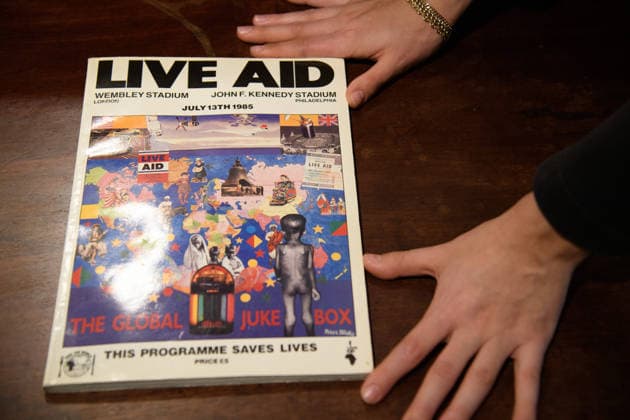 Bonhams Sound & Cinema: With Property from The Marianne Faithfull Estate Sale - Bonhams, London, UK - 1 December 2025 A staff member views An Autographed Live Aid Programme various artists autographs (est. Â£3k - Â£4k) which is on auction at Bonhams Sound & Cinema: With Property from The Marianne Faithfull Estate Sale ending from 3rd December 2025 at Bonhams in London, England, UK on Monday 1 December, 2025., Credit:Justin Ng Avalon UK, England, London, Bonhams  Copyright: xJustinxNgx xAvalonx 1055809900